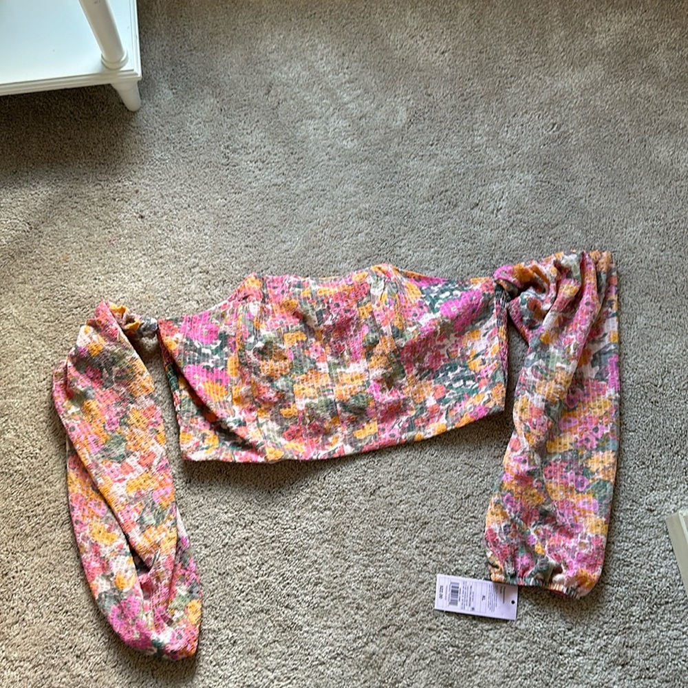 Corset top with attached sleeves. Never worn new with tags